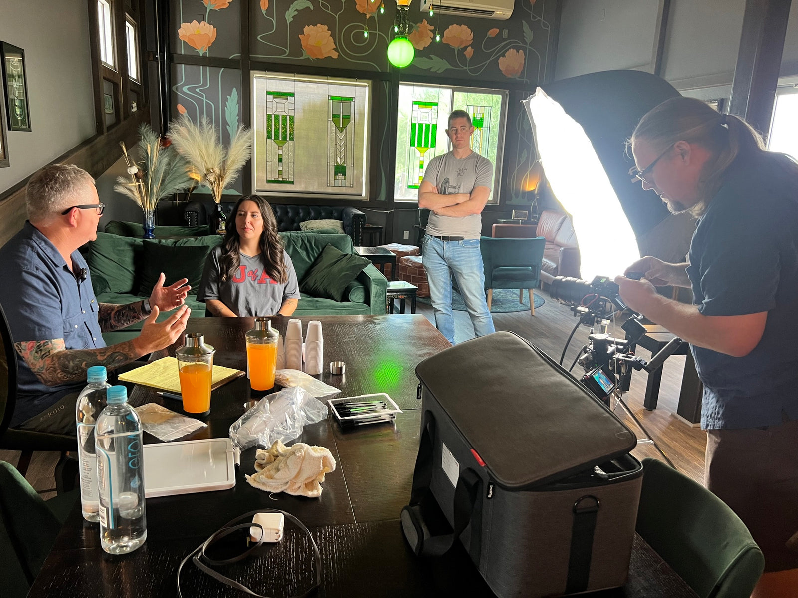 Filming taste-test responses during a recovery-drink testing session at a local pub